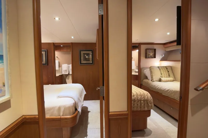 Family Time Yacht Photos Pics Luxurious interior of 2006 Cheoy Lee 84 Bravo yacht with cozy bedrooms and elegant decor.