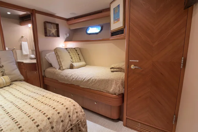 Family Time Yacht Photos Pics Luxurious cabin interior of 2006 Cheoy Lee 84 Bravo yacht with cozy bedding.