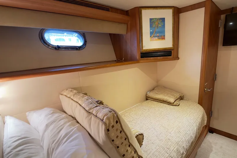 Family Time Yacht Photos Pics Luxurious cabin interior of 2006 Cheoy Lee 84 Bravo yacht with cozy bedding and artwork.