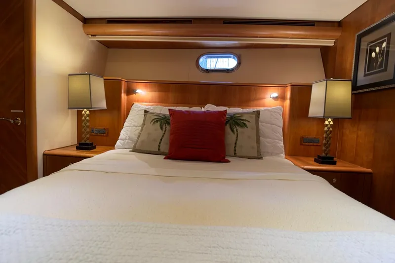 Family Time Yacht Photos Pics Luxurious bedroom interior of 2006 Cheoy Lee 84 Bravo yacht with elegant decor.
