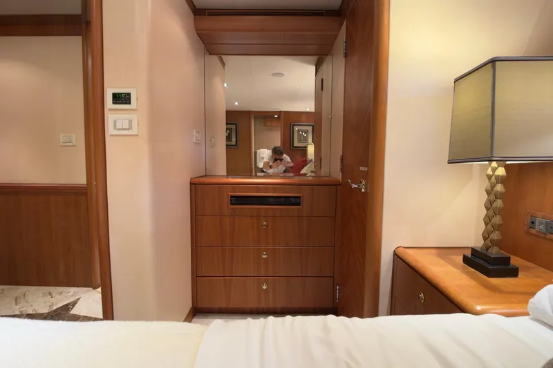 Family Time Yacht Photos Pics Luxurious interior of 2006 Cheoy Lee 84 Bravo yacht with elegant wood furnishings.