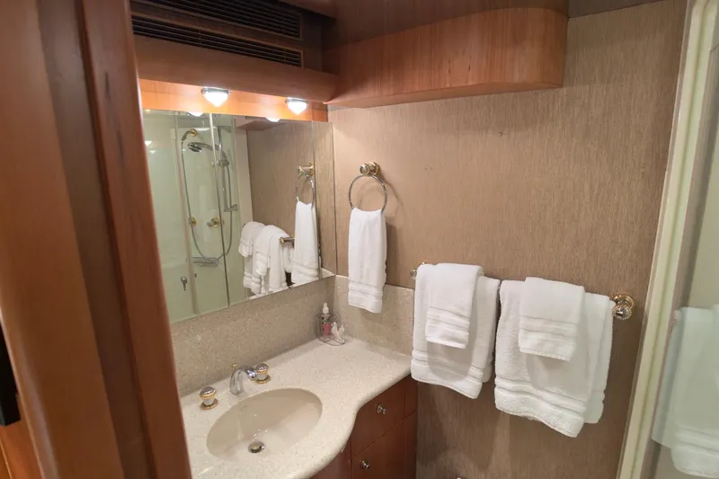 Family Time Yacht Photos Pics Luxurious bathroom in 2006 Cheoy Lee 84 Bravo yacht with elegant fixtures and plush towels.