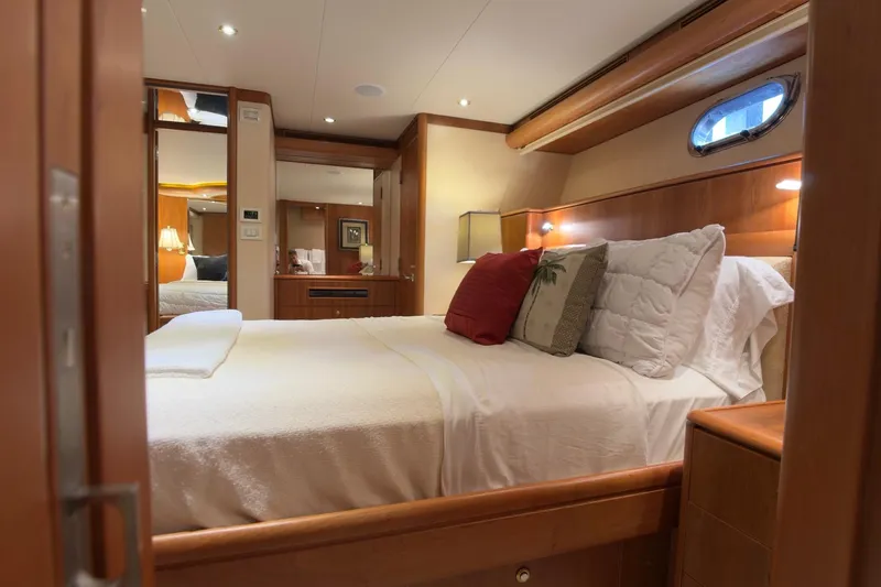 Family Time Yacht Photos Pics Luxurious bedroom interior of 2006 Cheoy Lee 84 Bravo yacht with elegant wood finishes.