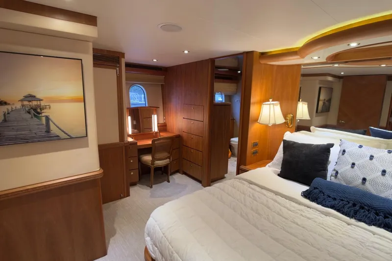 Family Time Yacht Photos Pics Luxurious 2006 Cheoy Lee 84 Bravo yacht bedroom with elegant wood finishes and cozy decor.