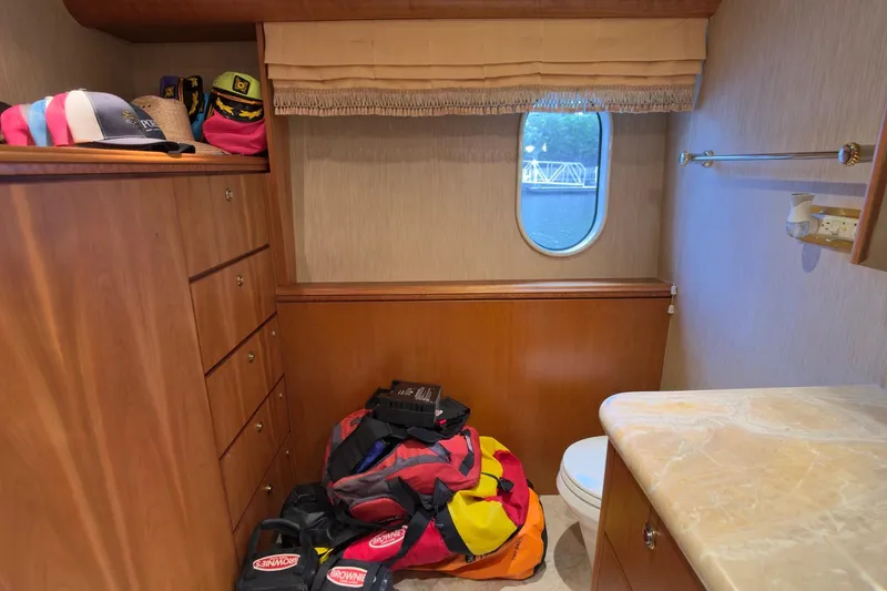 Family Time Yacht Photos Pics 2006 Cheoy Lee 84 Bravo yacht interior with storage, window, and bathroom amenities.