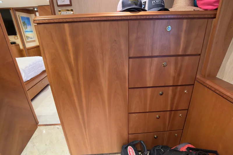 Family Time Yacht Photos Pics Wooden cabinetry and drawers inside a 2006 Cheoy Lee 84 Bravo yacht interior.