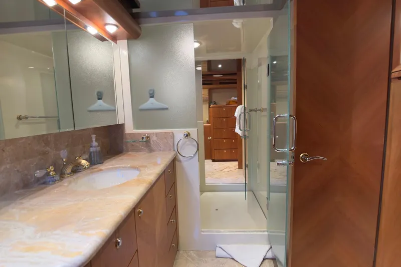 Family Time Yacht Photos Pics Luxurious bathroom interior of 2006 Cheoy Lee 84 Bravo yacht with marble countertop.