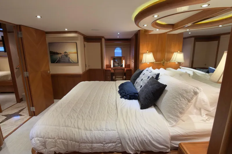 Family Time Yacht Photos Pics Luxurious bedroom interior of 2006 Cheoy Lee 84 Bravo yacht with elegant wood finishes.