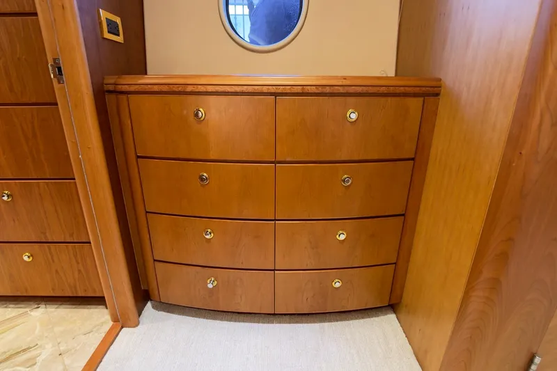 Family Time Yacht Photos Pics Wooden dresser with brass handles on 2006 Cheoy Lee 84 Bravo yacht interior.
