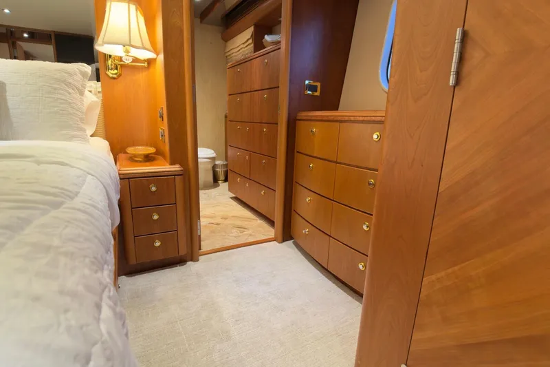 Family Time Yacht Photos Pics Luxurious wooden interior of 2006 Cheoy Lee 84 Bravo yacht bedroom and bathroom.