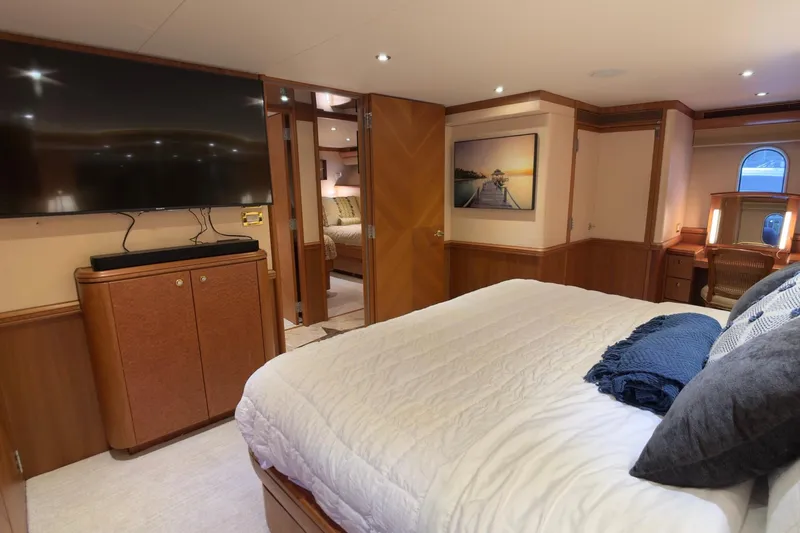 Family Time Yacht Photos Pics Luxurious bedroom interior of 2006 Cheoy Lee 84 Bravo yacht with modern amenities.