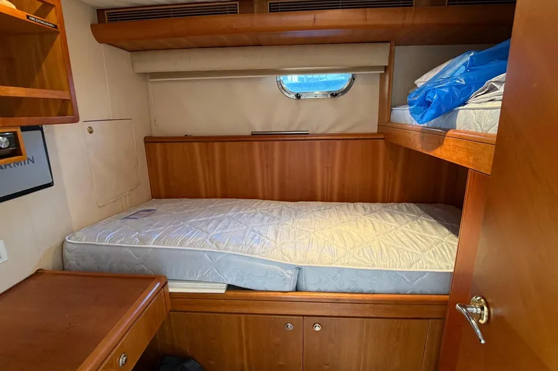 Family Time Yacht Photos Pics Cozy cabin interior of 2006 Cheoy Lee 84 Bravo yacht with wooden furnishings.