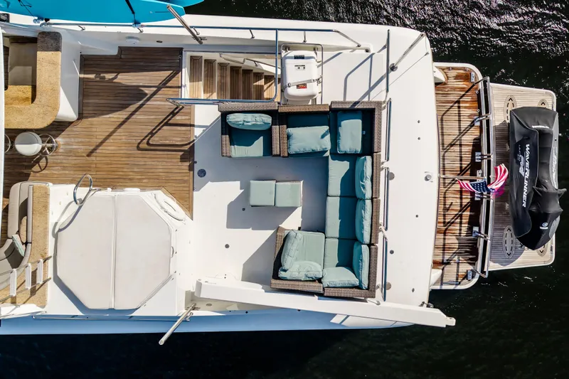 Family Time Yacht Photos Pics Aerial view of 2006 Cheoy Lee 84 Bravo yacht deck with seating and jet ski.