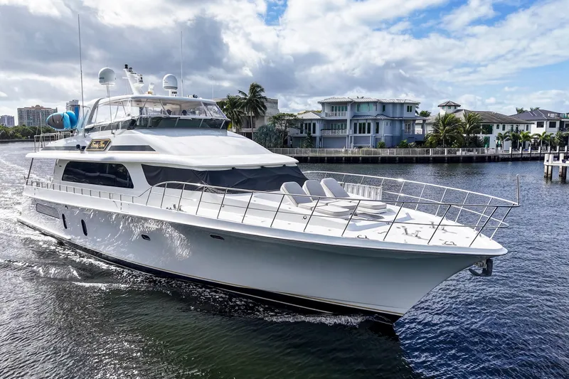 Family Time Yacht Photos Pics Luxury 2006 Cheoy Lee 84 Bravo yacht cruising on a scenic waterway.