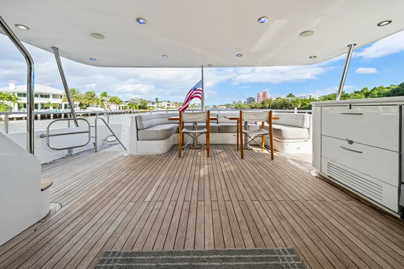 Family Time Yacht Photos Pics Spacious deck of 2006 Cheoy Lee 84 Bravo yacht with seating and American flag.