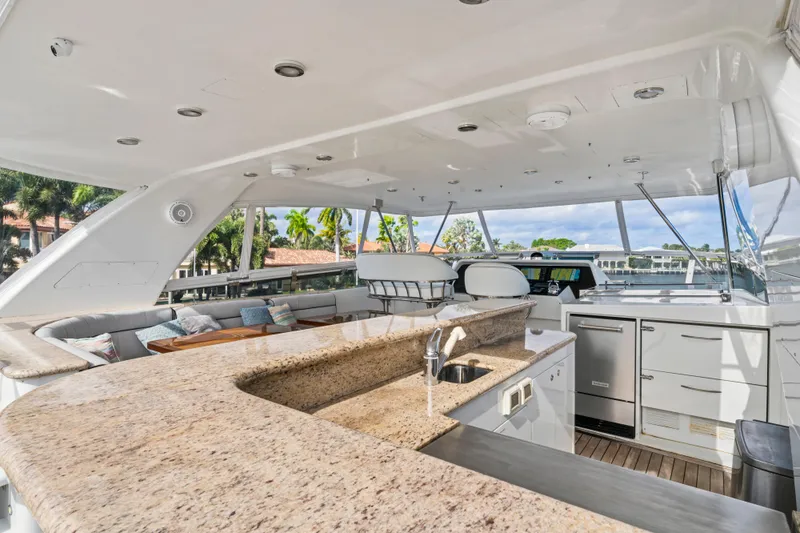 Family Time Yacht Photos Pics Luxurious 2006 Cheoy Lee 84 Bravo yacht interior with elegant bar and seating area.