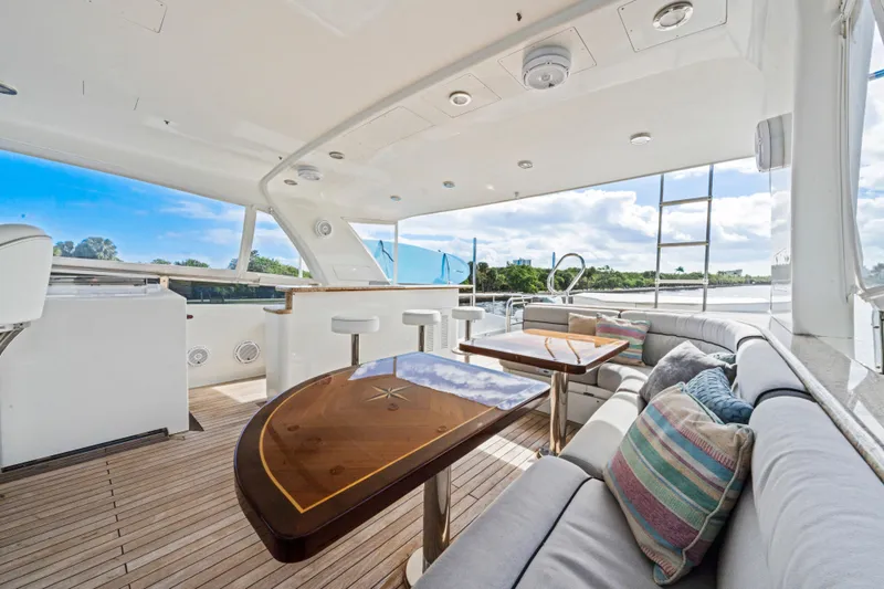 Family Time Yacht Photos Pics Luxurious 2006 Cheoy Lee 84 Bravo yacht interior with elegant seating and scenic views.