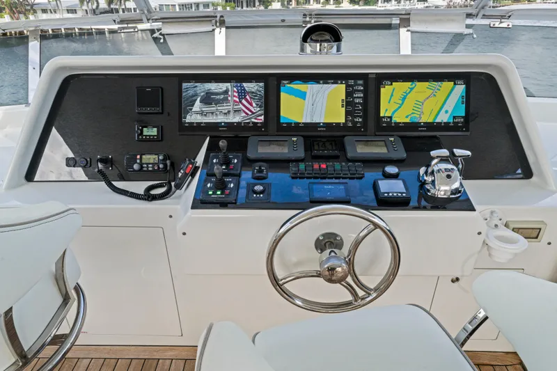 Family Time Yacht Photos Pics Helm of 2006 Cheoy Lee 84 Bravo yacht with navigation screens and controls.