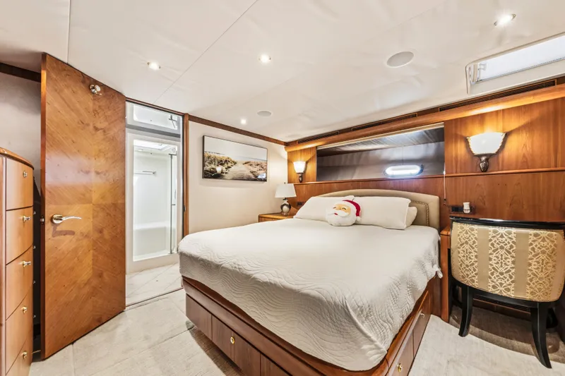 Family Time Yacht Photos Pics Luxurious bedroom interior of 2006 Cheoy Lee 84 Bravo yacht with elegant wood finishes.