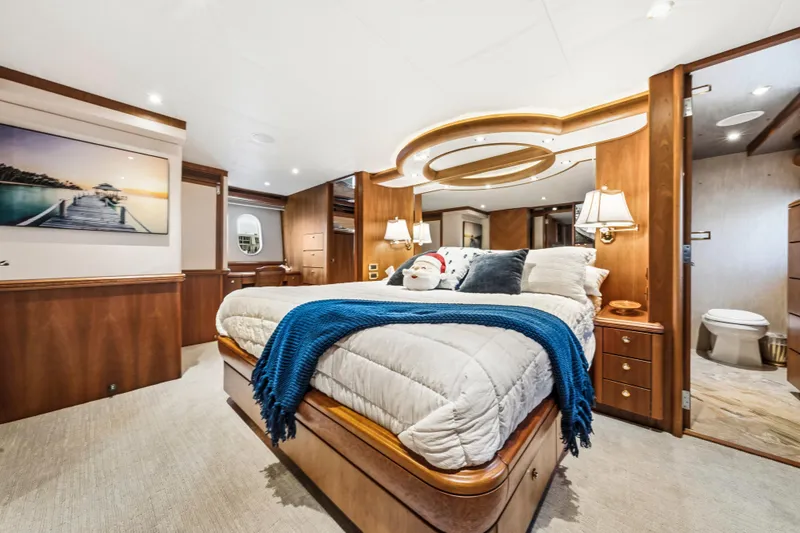 Family Time Yacht Photos Pics Luxurious bedroom interior of 2006 Cheoy Lee 84 Bravo yacht with elegant wood finishes.