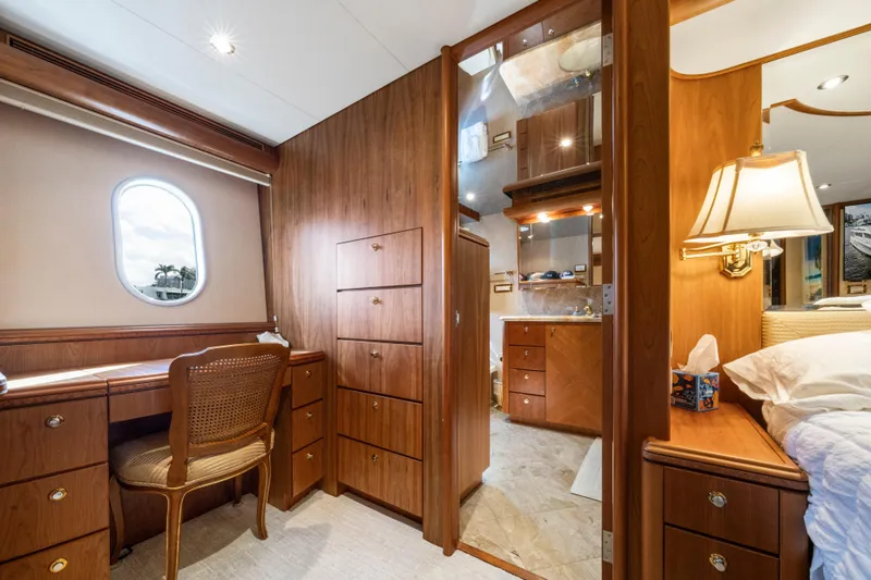 Family Time Yacht Photos Pics Luxurious interior of 2006 Cheoy Lee 84 Bravo yacht with elegant wood furnishings.