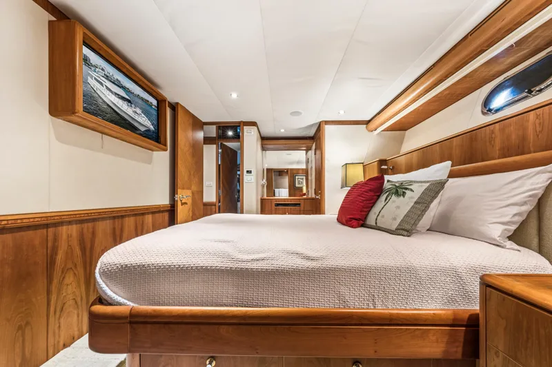 Family Time Yacht Photos Pics Luxurious bedroom interior of 2006 Cheoy Lee 84 Bravo yacht with elegant wood finishes.