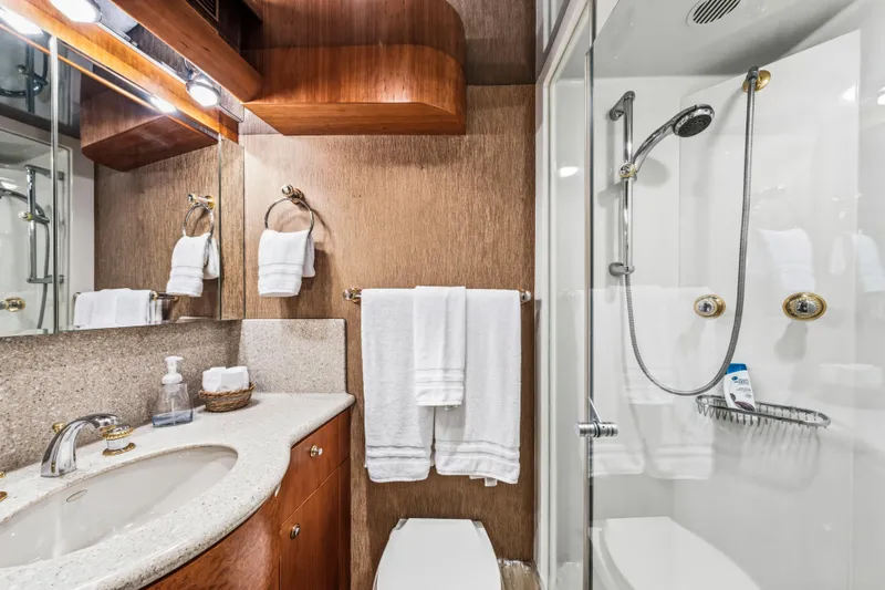 Family Time Yacht Photos Pics Luxurious bathroom in 2006 Cheoy Lee 84 Bravo yacht with modern fixtures and elegant design.