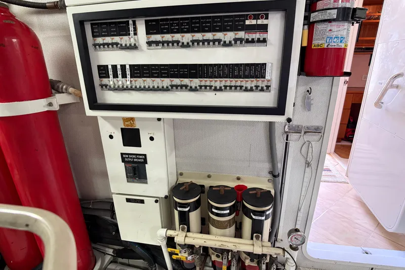 Family Time Yacht Photos Pics Electrical panel and fire extinguisher in 2006 Cheoy Lee 84 Bravo yacht engine room.