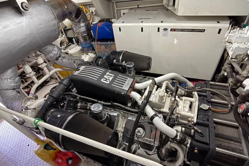 Family Time Yacht Photos Pics Engine room of 2006 Cheoy Lee 84 Bravo yacht with CAT machinery and Northern Lights generator.