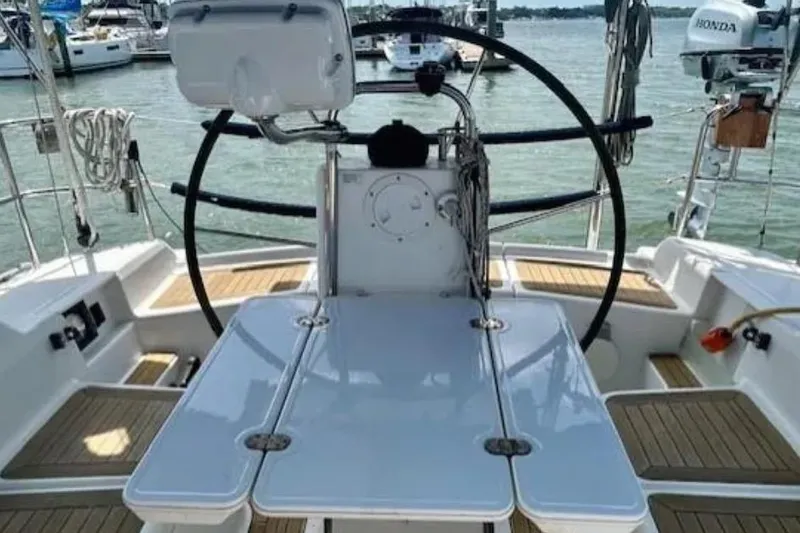 Valanta Yacht Photos Pics Cockpit of 2007 Hanse 400 sailboat with steering wheel and teak flooring.