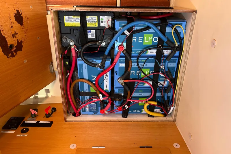 Valanta Yacht Photos Pics Battery compartment of a 2007 Hanse 400 yacht with lithium-ion batteries and wiring.
