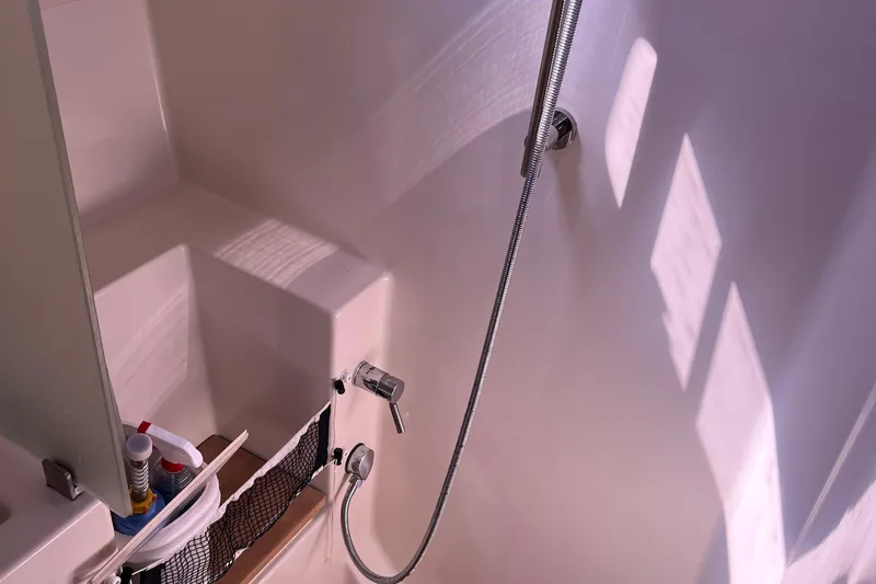 Valanta Yacht Photos Pics Shower area in 2007 Hanse 400 yacht with modern fixtures and storage.