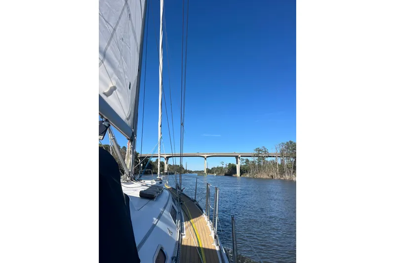Valanta Yacht Photos Pics 2007 Hanse 400 sailboat under bridge on river.