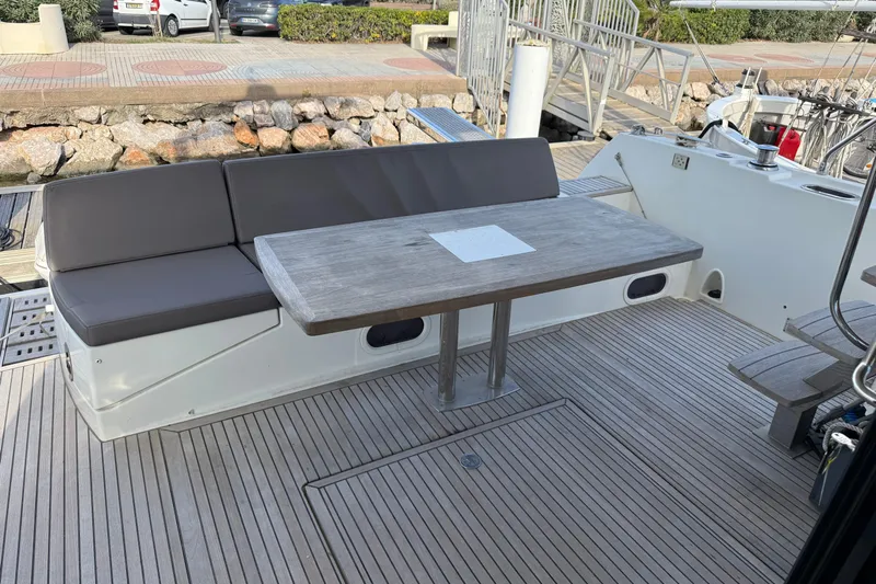  Yacht Photos Pics 2017 Prestige 560 Fly yacht deck with seating and wooden table.