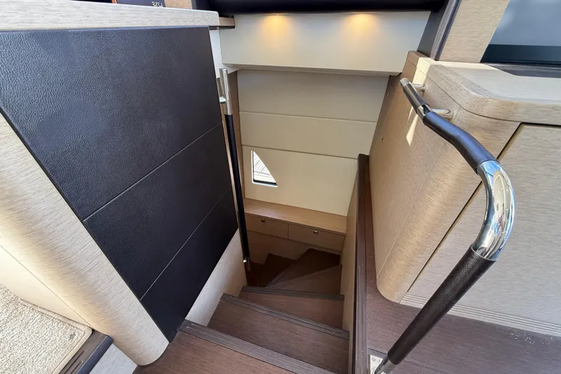  Yacht Photos Pics Staircase inside 2017 Prestige 560 Fly yacht, featuring modern design and elegant finishes.