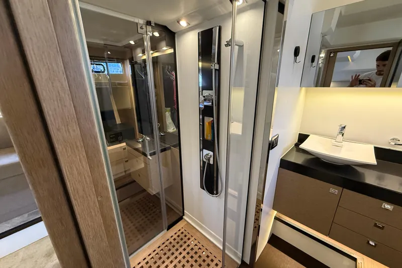  Yacht Photos Pics Luxurious bathroom interior of 2017 Prestige 560 Fly yacht with modern fixtures.