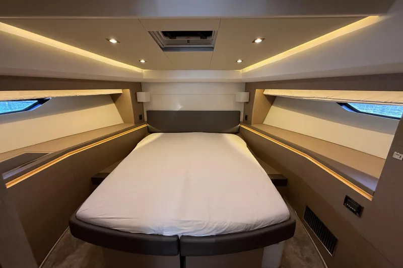  Yacht Photos Pics Luxurious bedroom interior of 2017 Prestige 560 Fly yacht with modern lighting.