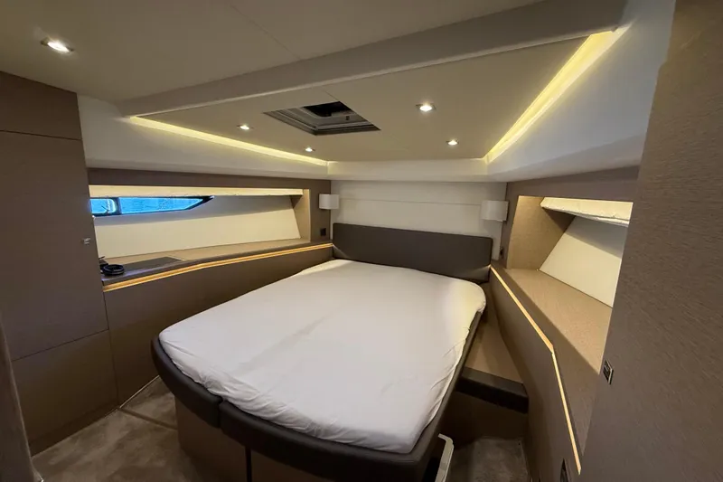  Yacht Photos Pics Luxurious bedroom interior of 2017 Prestige 560 Fly yacht with modern lighting and cozy bed.