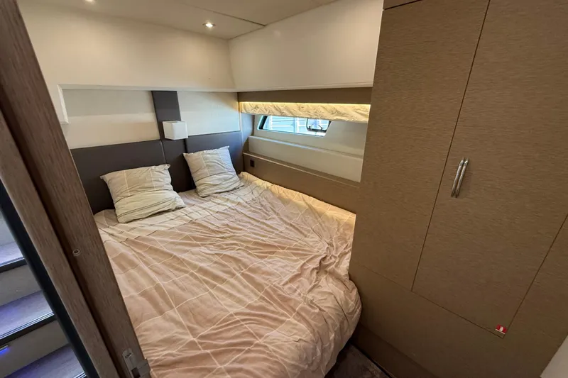  Yacht Photos Pics Luxurious bedroom interior of 2017 Prestige 560 Fly yacht with cozy bedding.