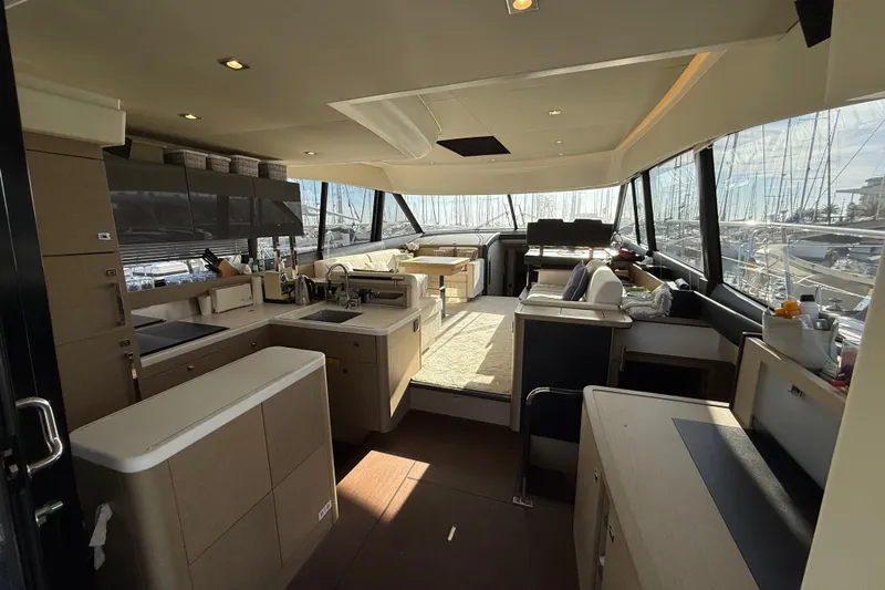  Yacht Photos Pics Luxurious interior of a 2017 Prestige 560 Fly yacht with modern kitchen and seating area.