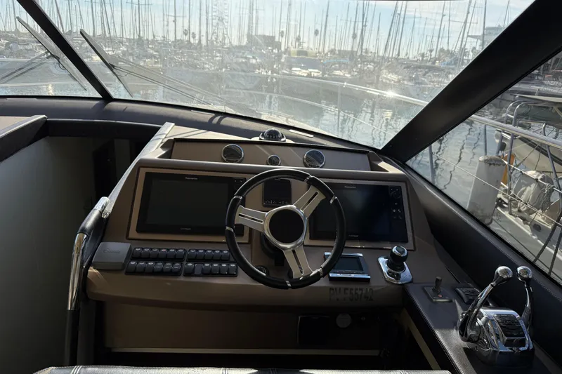  Yacht Photos Pics Cockpit of 2017 Prestige 560 Fly yacht with modern navigation controls and steering wheel.