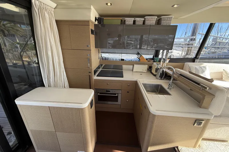  Yacht Photos Pics Luxurious kitchen interior of 2017 Prestige 560 Fly yacht with modern amenities.