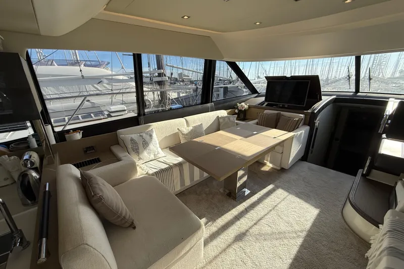  Yacht Photos Pics Luxurious interior of 2017 Prestige 560 Fly yacht with elegant seating and large windows.