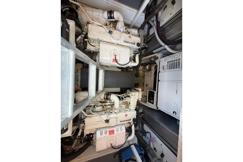  Yacht Photos Pics Engine room of 2017 Prestige 560 Fly yacht, showcasing dual engines and equipment.