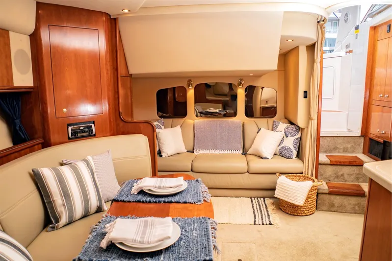 Hadi Yacht Photos Pics Luxurious interior of 2005 Cruisers Yachts 370 Express with elegant seating and dining area.