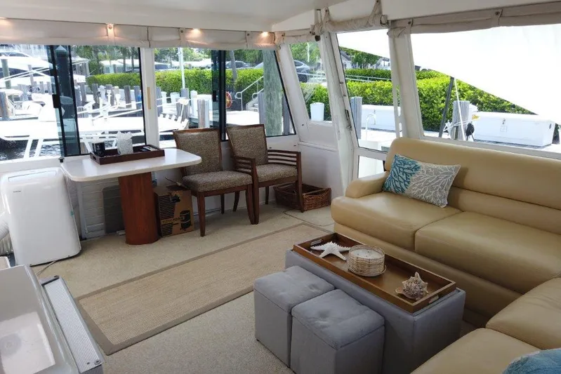 Marlintini Yacht Photos Pics Luxurious interior of a 1999 Viking Cockpit Motoryacht with elegant seating and decor.