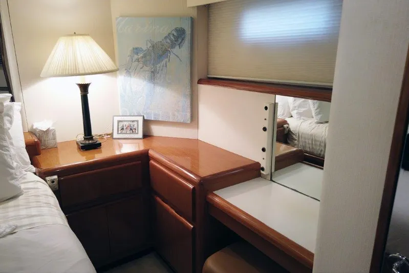 Marlintini Yacht Photos Pics 1999 Viking Cockpit Motoryacht interior with wooden desk, lamp, and mirror.