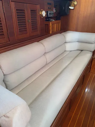 Isabella II Yacht Photos Pics Luxurious interior of 1988 Shannon 43 yacht with plush beige seating.