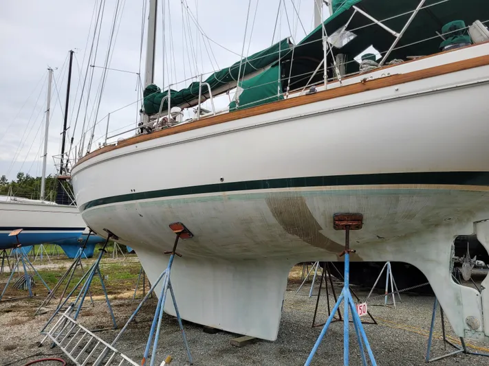 Isabella II Yacht Photos Pics 1988 Shannon 43 sailboat on stands, undergoing maintenance in a boatyard.