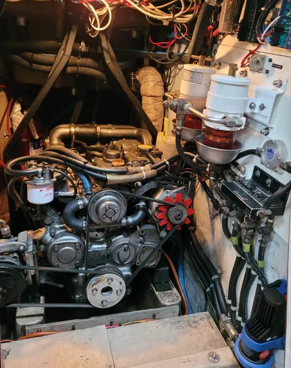 Isabella II Yacht Photos Pics Engine room of a 1988 Shannon 43 boat, showcasing detailed mechanical components.